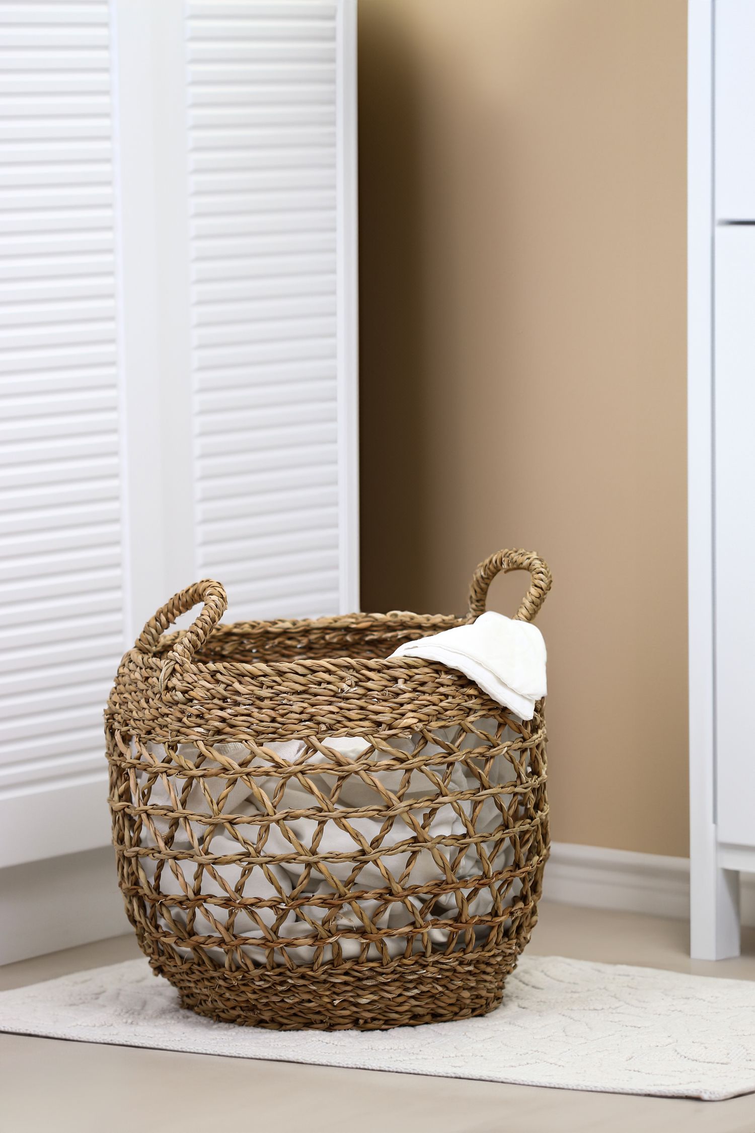Woven laundry basket in a room