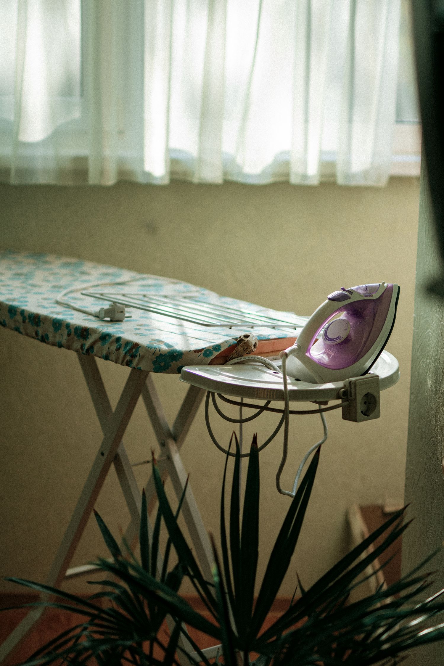 Ironing board with an iron