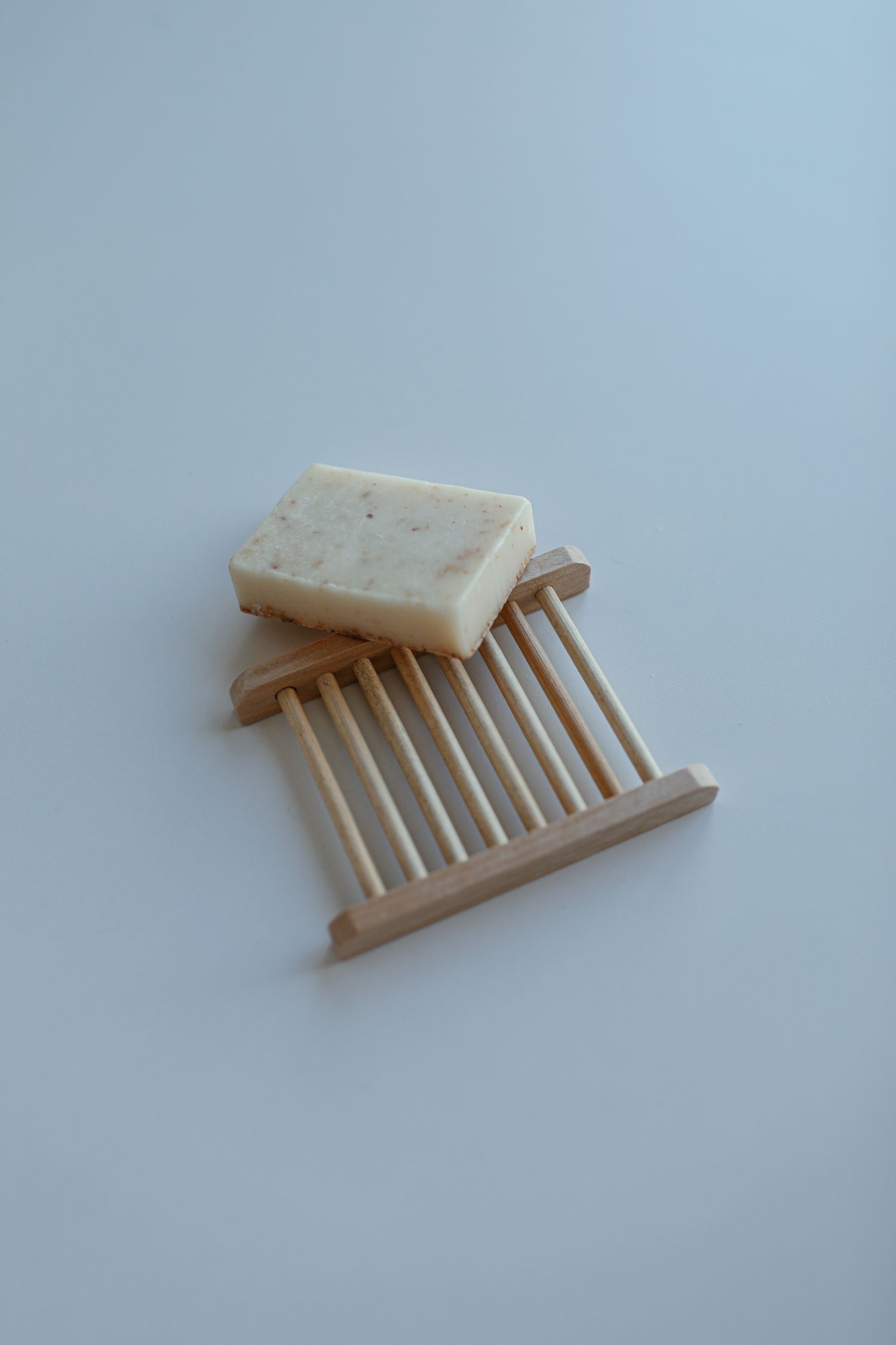 Soap resting on a wooden soap dish