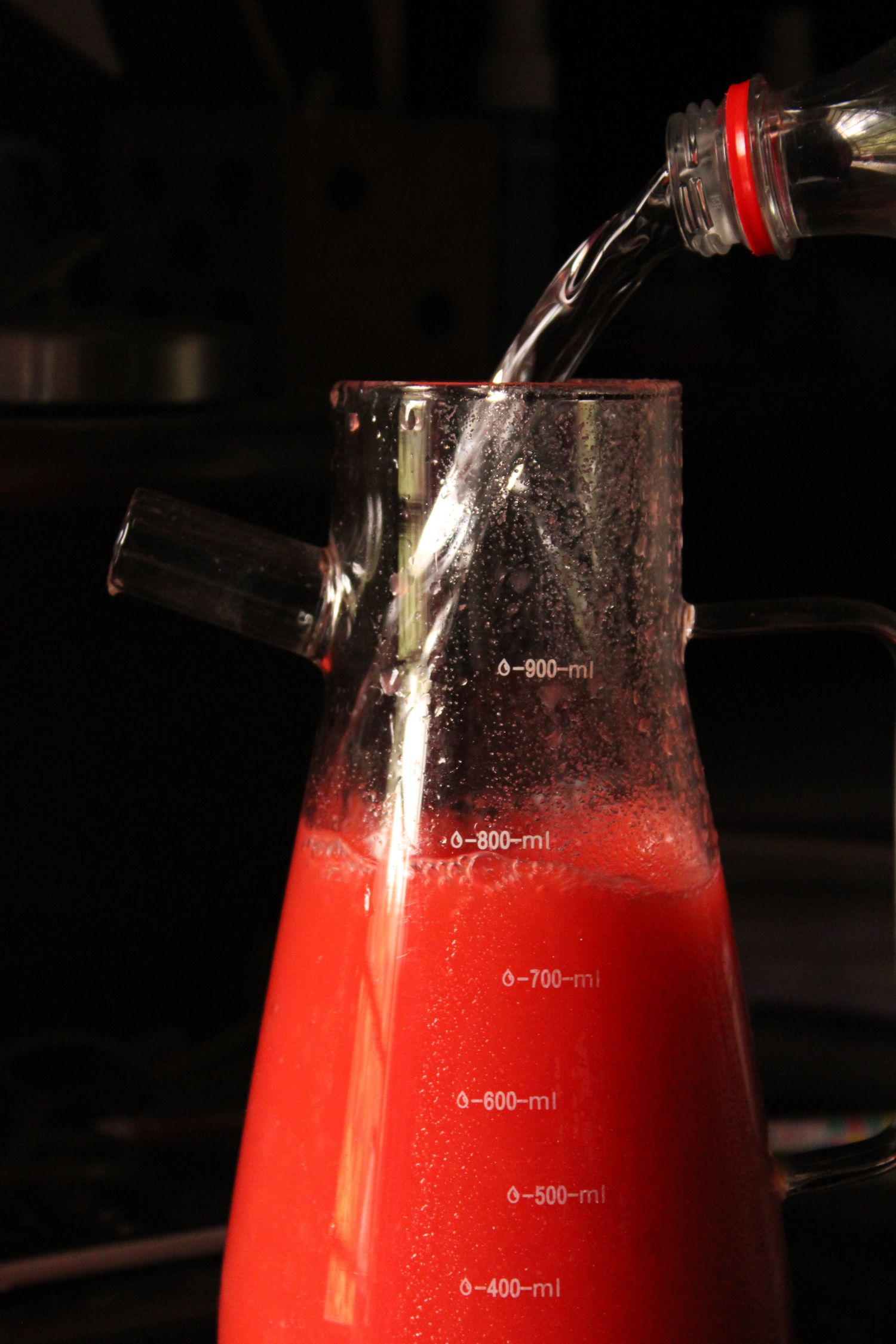 Measuring jug filled with a red drink