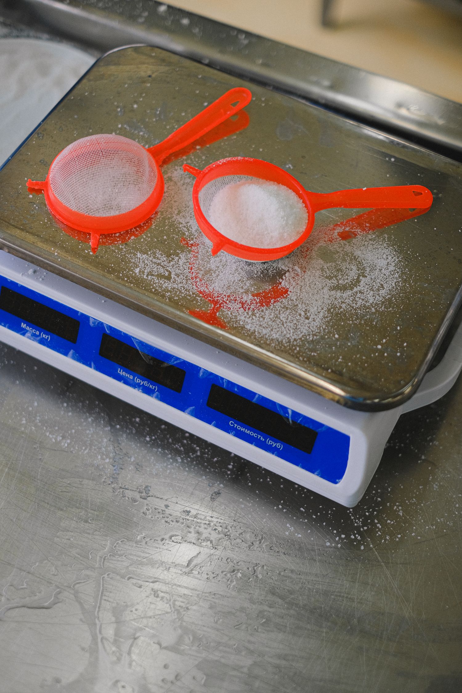 Flour and a sieve on kitchen scales