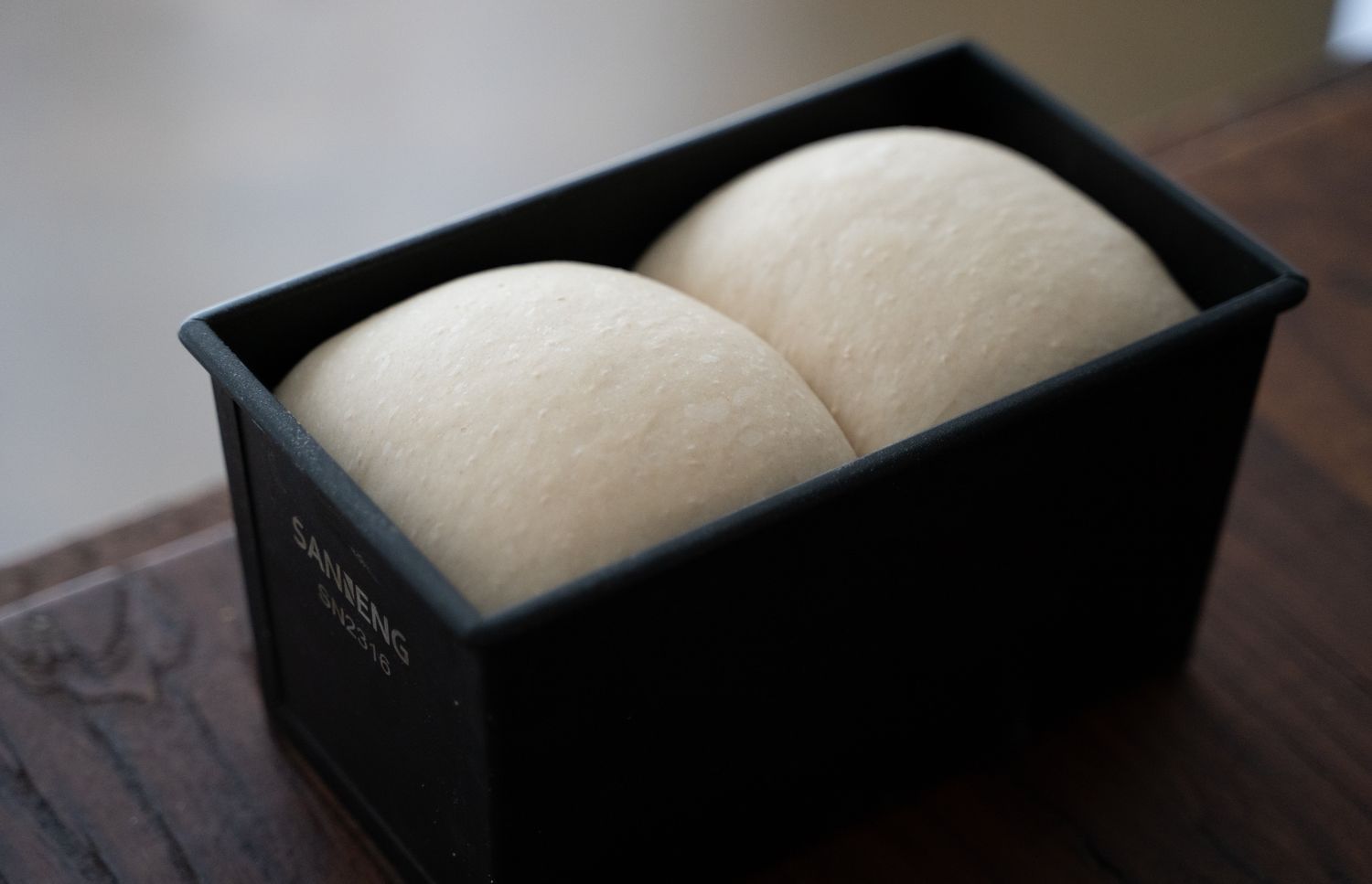 Unbaked dough in a loaf tin