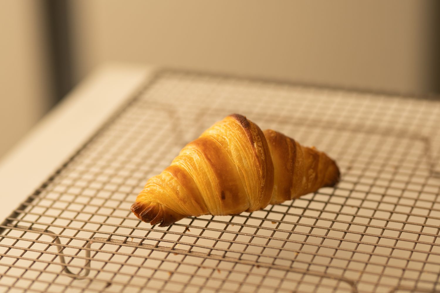 Croissant on a cooling rack