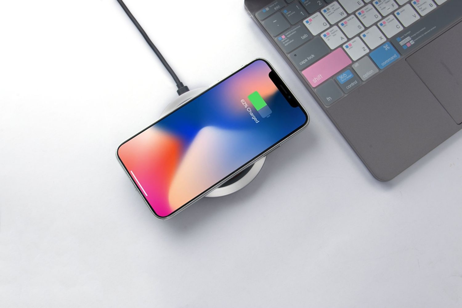 Smartphone resting on a wireless charging pad