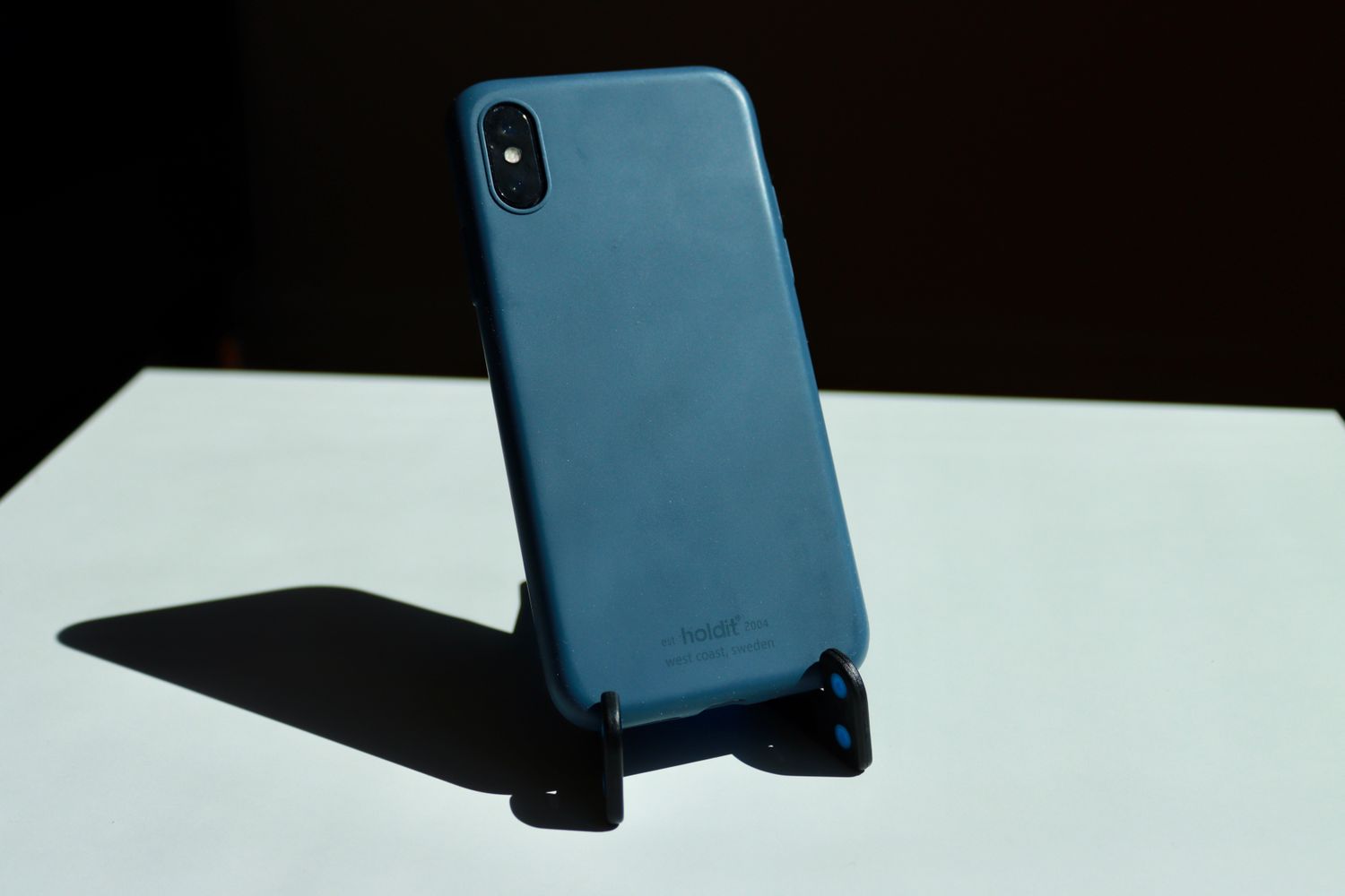 Smartphone held upright by a small stand