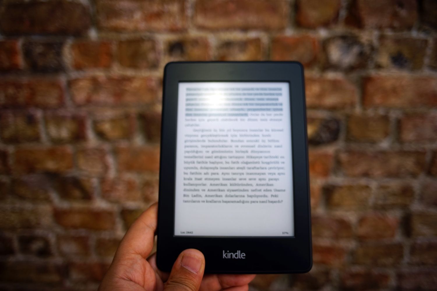 Person holding an e-reader