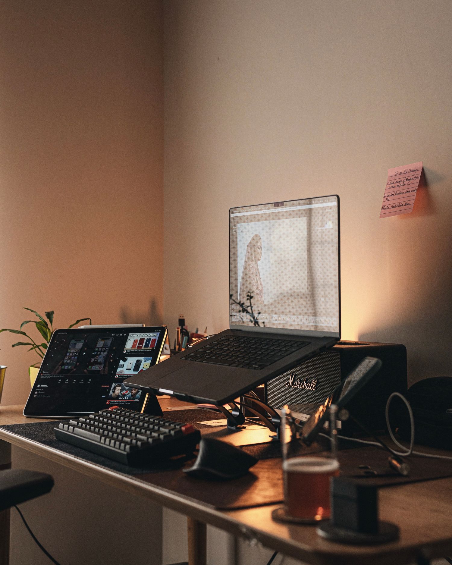 Laptop raised on a stand on a desk
