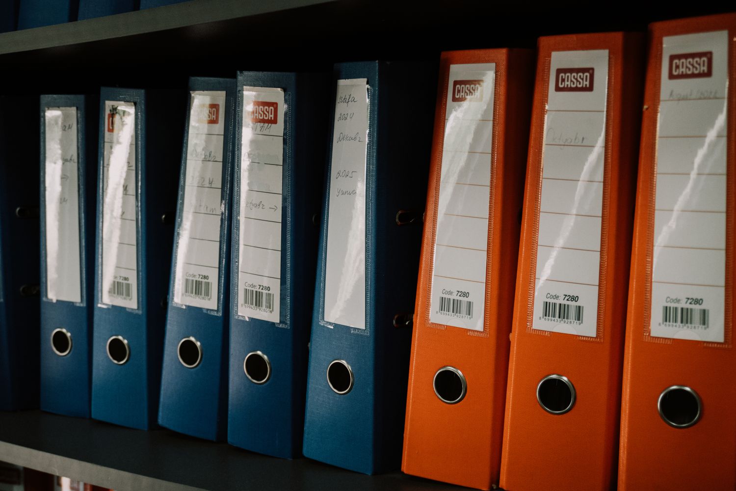 Ring binders arranged on a shelf