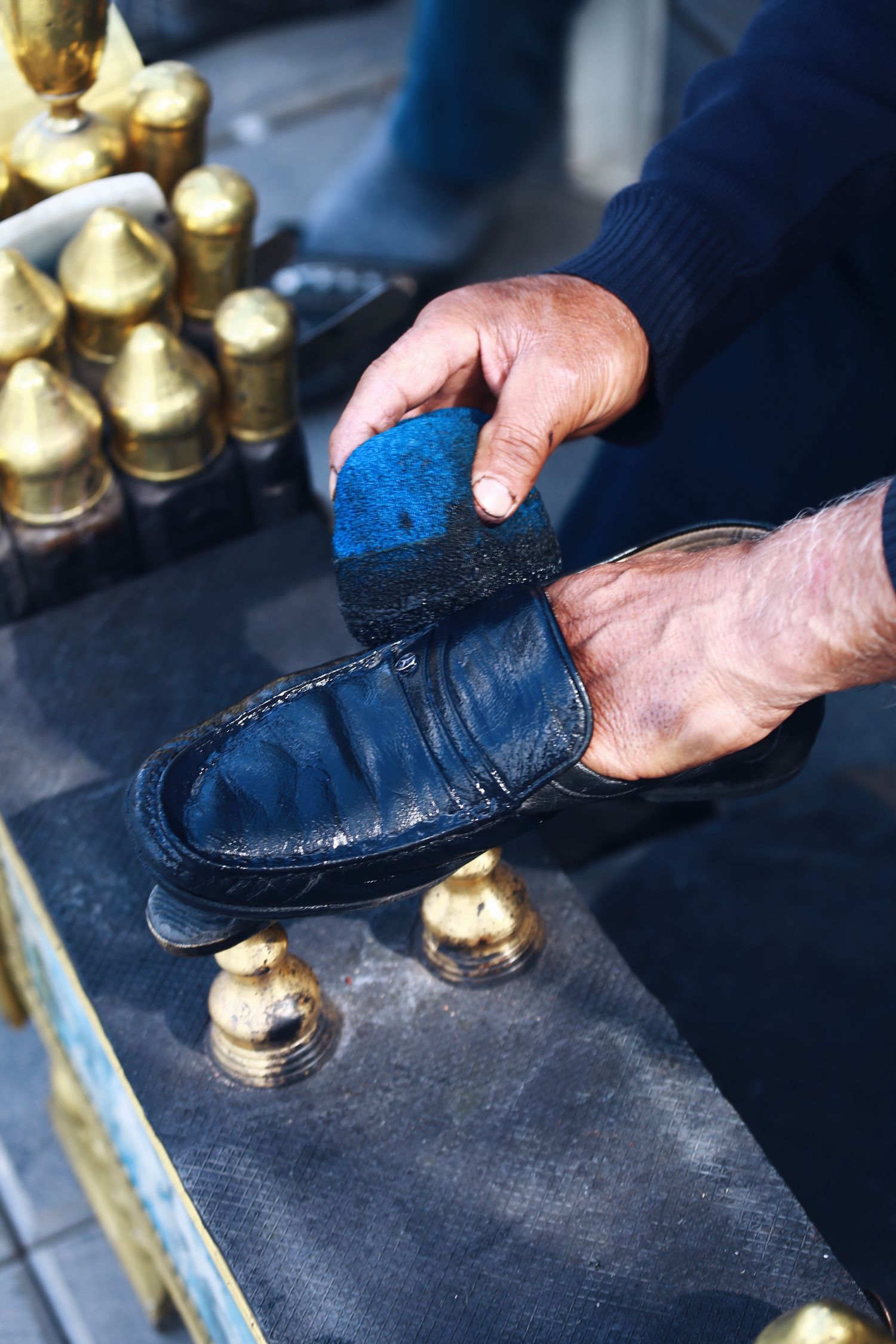 Shoe being brushed during cleaning