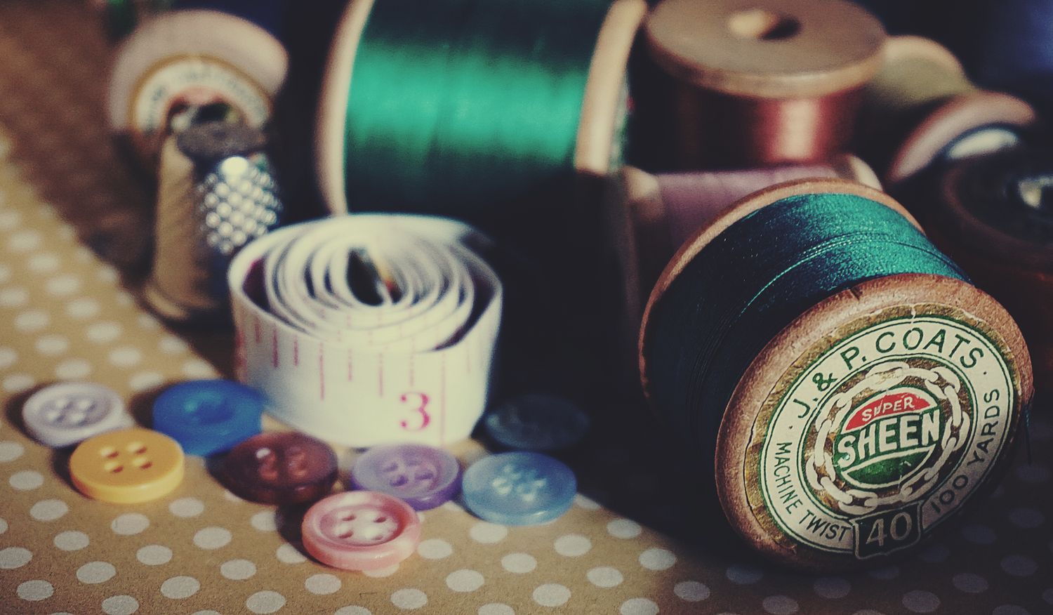 Thread, buttons and measuring tape in a sewing kit